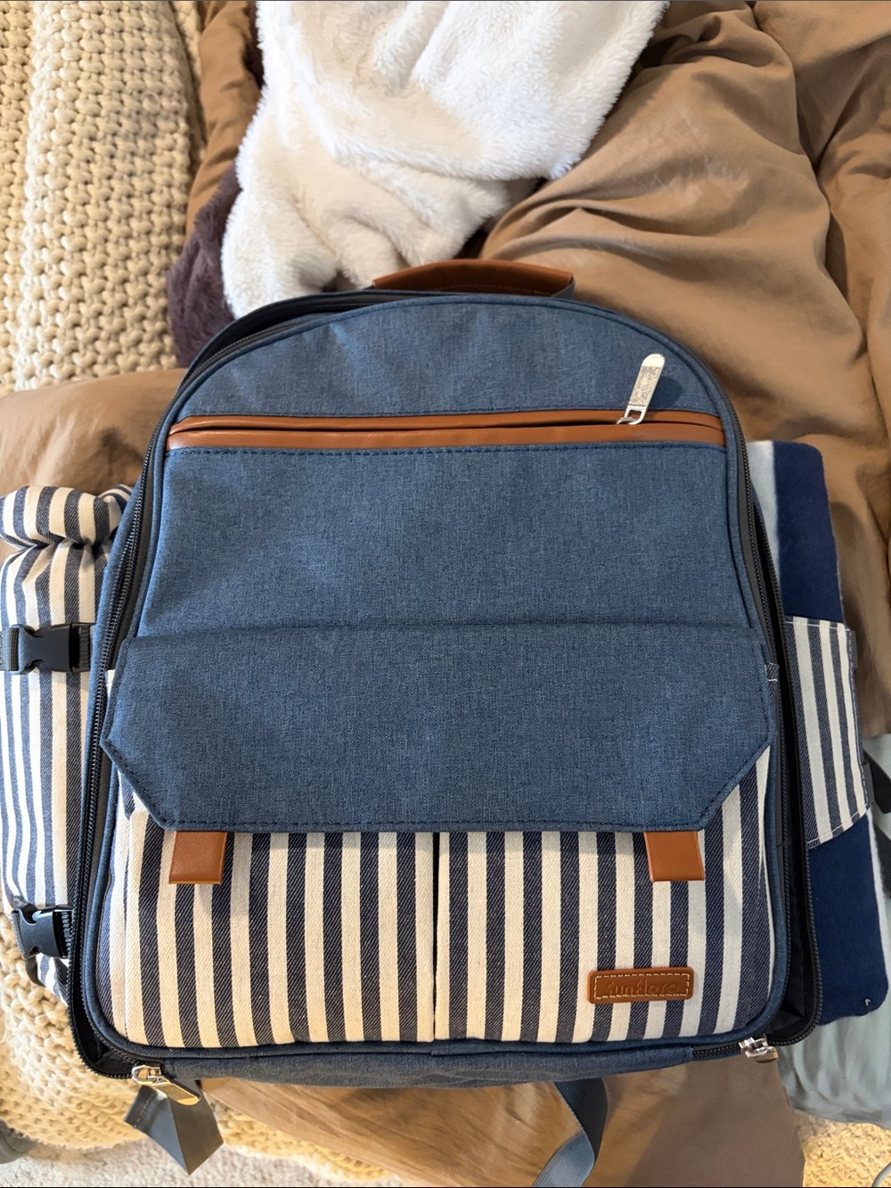 Sunflora blue and white striped picnic backpack.